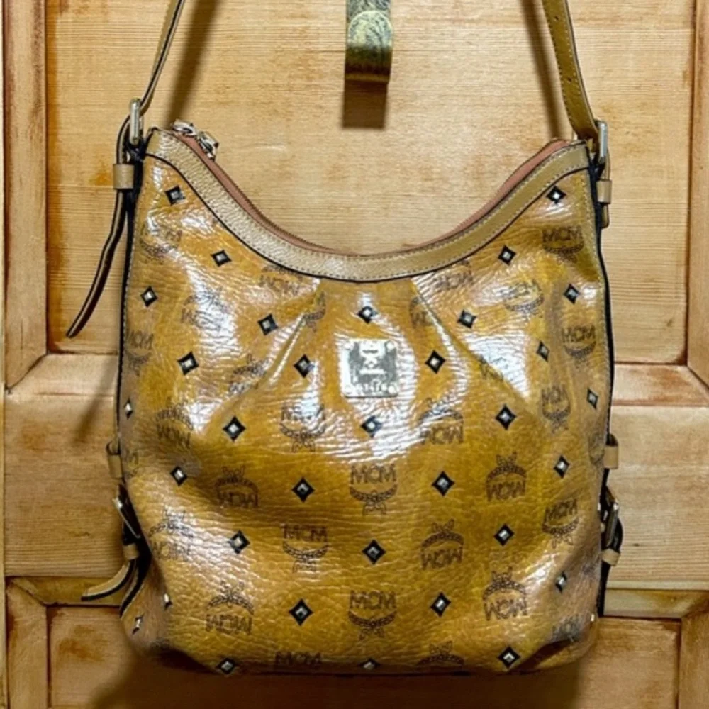 RESERVED - MCM genuine pebble grain leather studded bag with gold plated